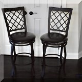 F26. Pair of metal counter stools. Seat height is 25” 